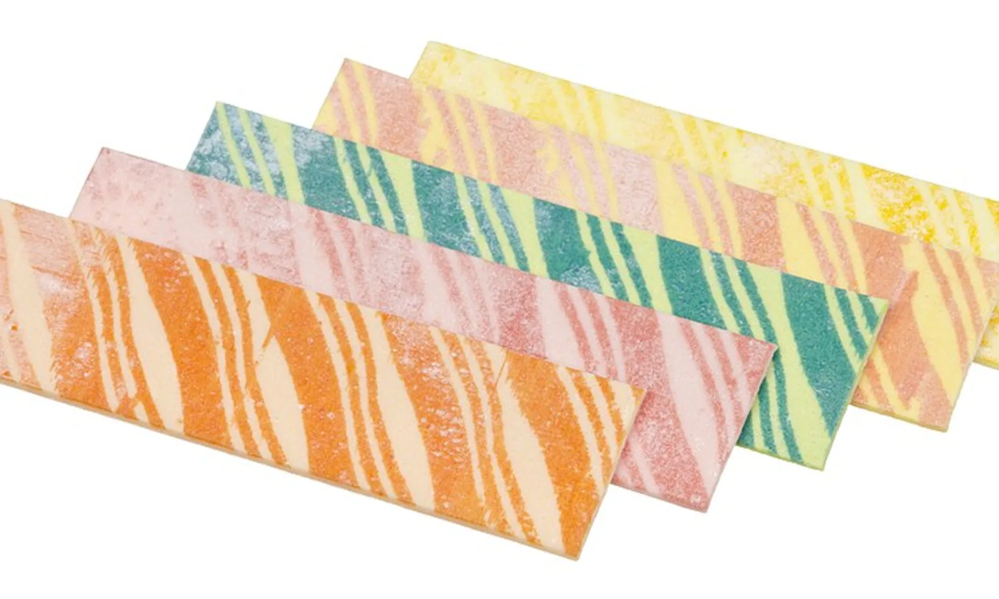 An array of Fruit Stripe gum flavors, which includes all five flavors in each pack of gum: melon, cherry, lemon, orange and peach