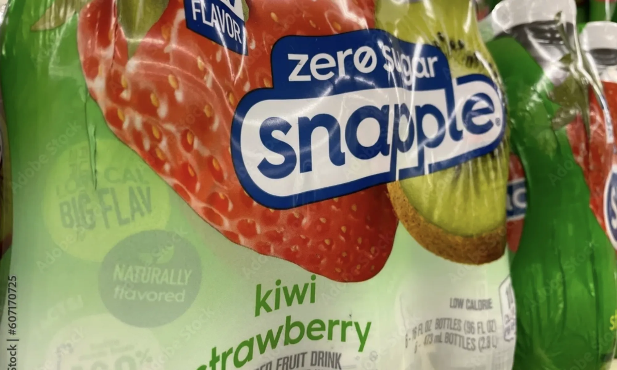 Close-up of Snapple Apple bottles on a grocery store shelf