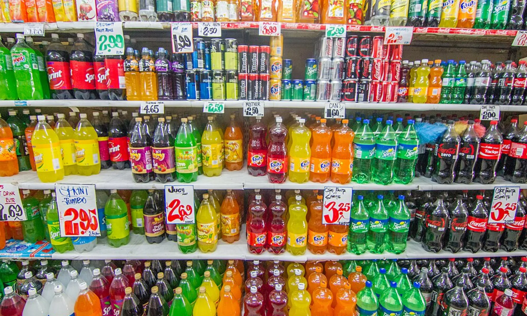 90s-era supermarket drink aisle with colorful beverages in glass-door coolers